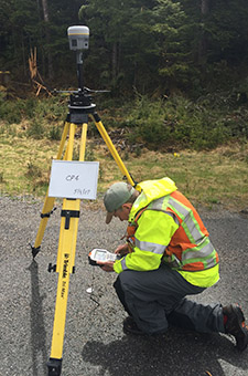 surveyor taking measurements